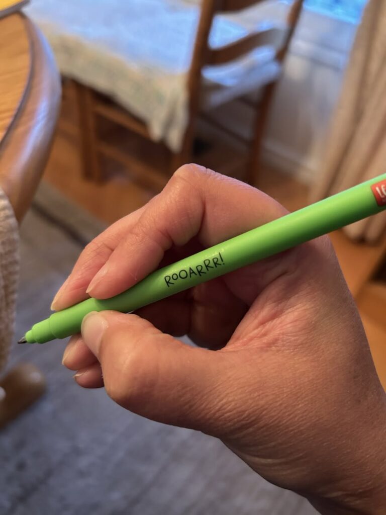 Strong pencil grip shown with hand holding pen.